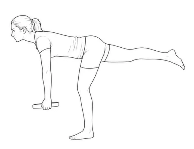 Single-leg deadlift with weight plate – Stay on your right leg with the knee slightly bent and tilt your upper body forward. Extend your left leg straight back and lower the plate toward the floor with straight arms. Return to the starting position.